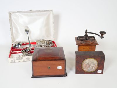 two small wooden boxes with silverware in them on a white surface