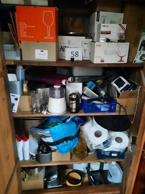 a cabinet with many items on it in the room