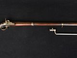 a rifle with a wooden barrel and a metal handle