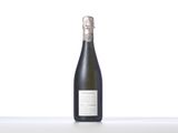 a bottle of champagne sitting on top of a white table