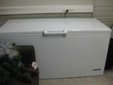 a white chest freezer sitting next to a christmas tree