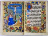 an open book with an image of jesus on the cross