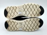 the soles of a pair of tennis shoes on a white surface