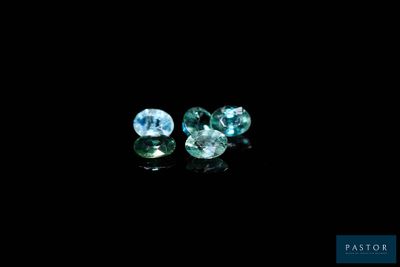 a pair of blue topazte gems on a black background
