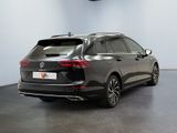 the rear view of a grey volkswagen v - cross parked in a showroom