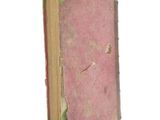 an old book that has been torn open on a white background
