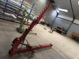 an image of a garage with a crane in the middle of the floor