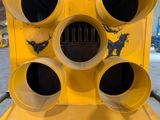 a yellow traffic light that has four round holes on it