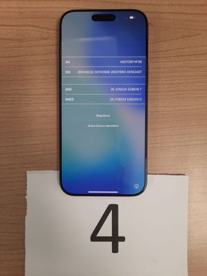 a close up of a phone on a table with a number 4 on it