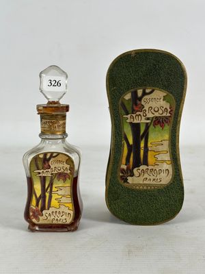 a small bottle of syrup next to a small bottle of syrup