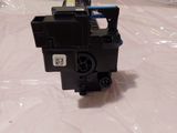 a small black device sitting on a plastic bag