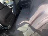 the back seats of a car are empty and the passenger seat is empty