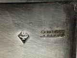 a close up of a metal object with a diamond on it