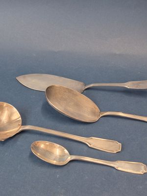 five spoons and two spoons sitting on a table