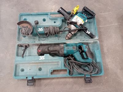 a blue tool box with tools in it on the floor
