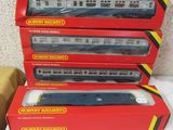 three boxed train cars sitting on top of each other on a table