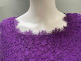 the back of a purple dress with a white collar on a mannequin mannequin mannequin mannequin mannequin mannequin manne