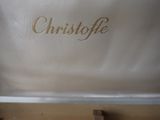 a close up of a silver suitcase with a name on it