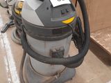 a vacuum that is sitting on the floor next to other items