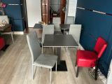 a table and chairs in a room with blue walls