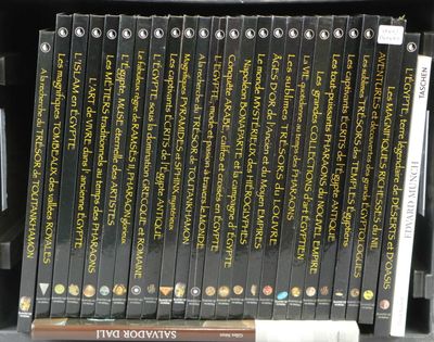 a lot of books that are on a shelf