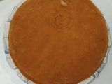 a pie sitting on top of a white plate on a table