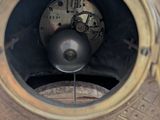 a close up of a clock that is on a table