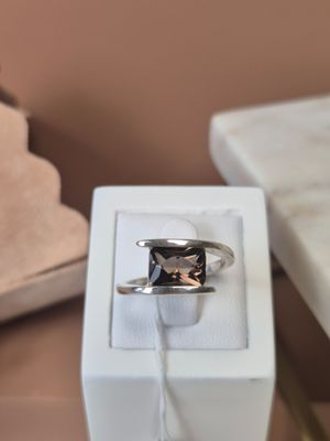 a ring that is sitting in a box on a table