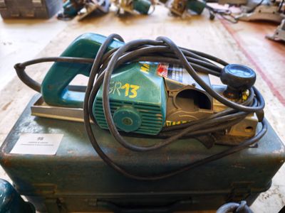 a green machine that is sitting on top of a table