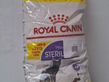 a bag of royal canin steril next to a bag of dog food