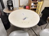 a table with a remote control on it in a room
