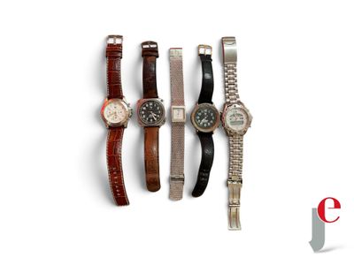 several watches are lined up in a row on a white surface