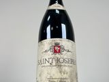 a bottle of wine that is sitting on a table