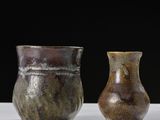 three vases sitting next to each other on a table
