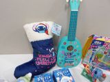 a guitar, a stocking, and other toys on a table