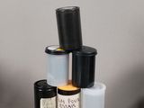 a stack of bottles and containers sitting on a table