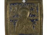 a gold plate with a picture of a man and a woman