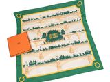 une boîte orange et une écharpe verte avec l'image d'un pont