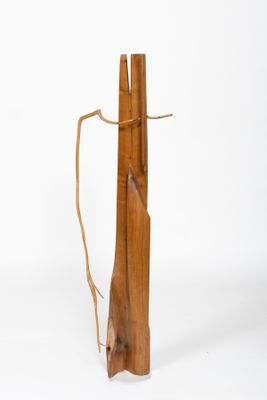 a piece of wood that has been tied up to a pole