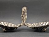 pair of antique silver plated candlesticks with ornate design