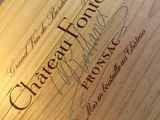 a close up of a wooden box with a sign on it