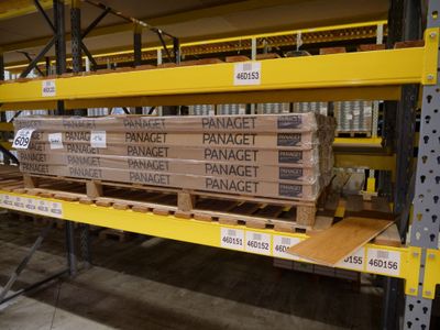 many boxes of bananas on a shelf in a warehouse