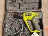 a tool in a case that is on the floor