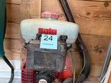 an image of a gas powered blower in a garage