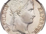 a close up of a coin with a woman ' s face on it