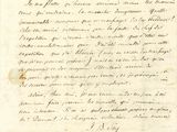 un vieux document écrit posé sur une table