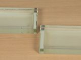 two glass trays sitting on a wooden table