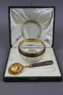 a glass jar with a spoon and a spoon rest in it