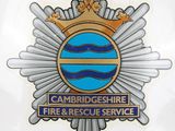 the badge of a fire and rescue service is shown on the back of a car