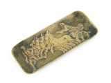 brass plate with a horse and rider on it on a white background